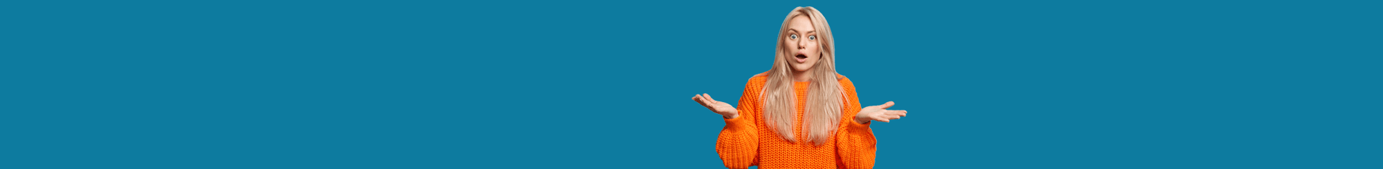 Person with blonde hair wearing bright orange sweater with arms raised