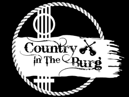 black background "country in the Burg" logo in white font with crossing guitars in black and guitar strings in the background